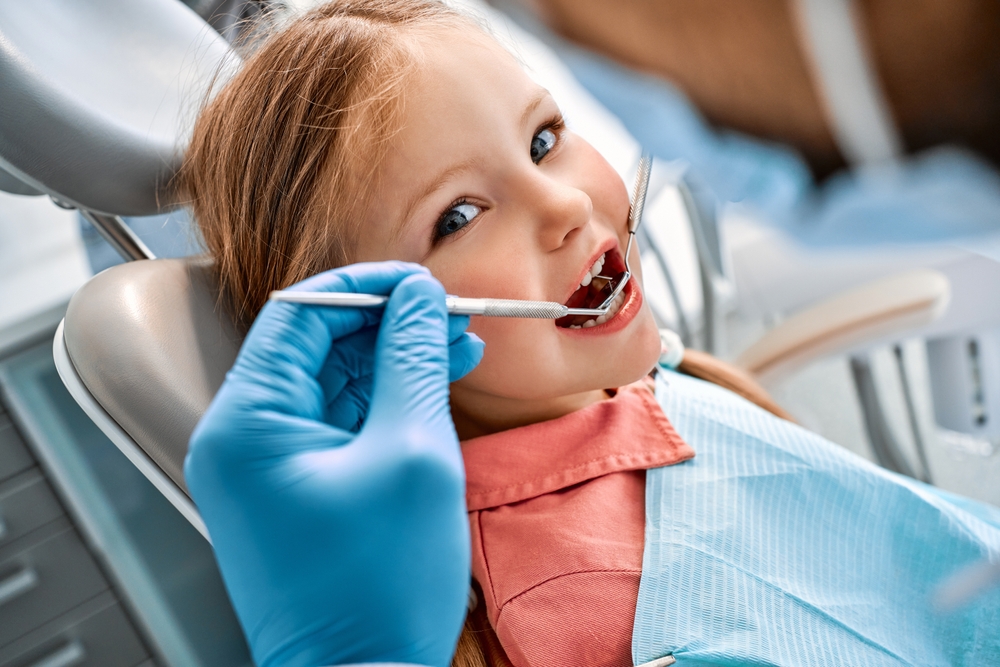 Children's,Dentistry.,Close-up,Portrait,Of,A,Girl,Sitting,In,A